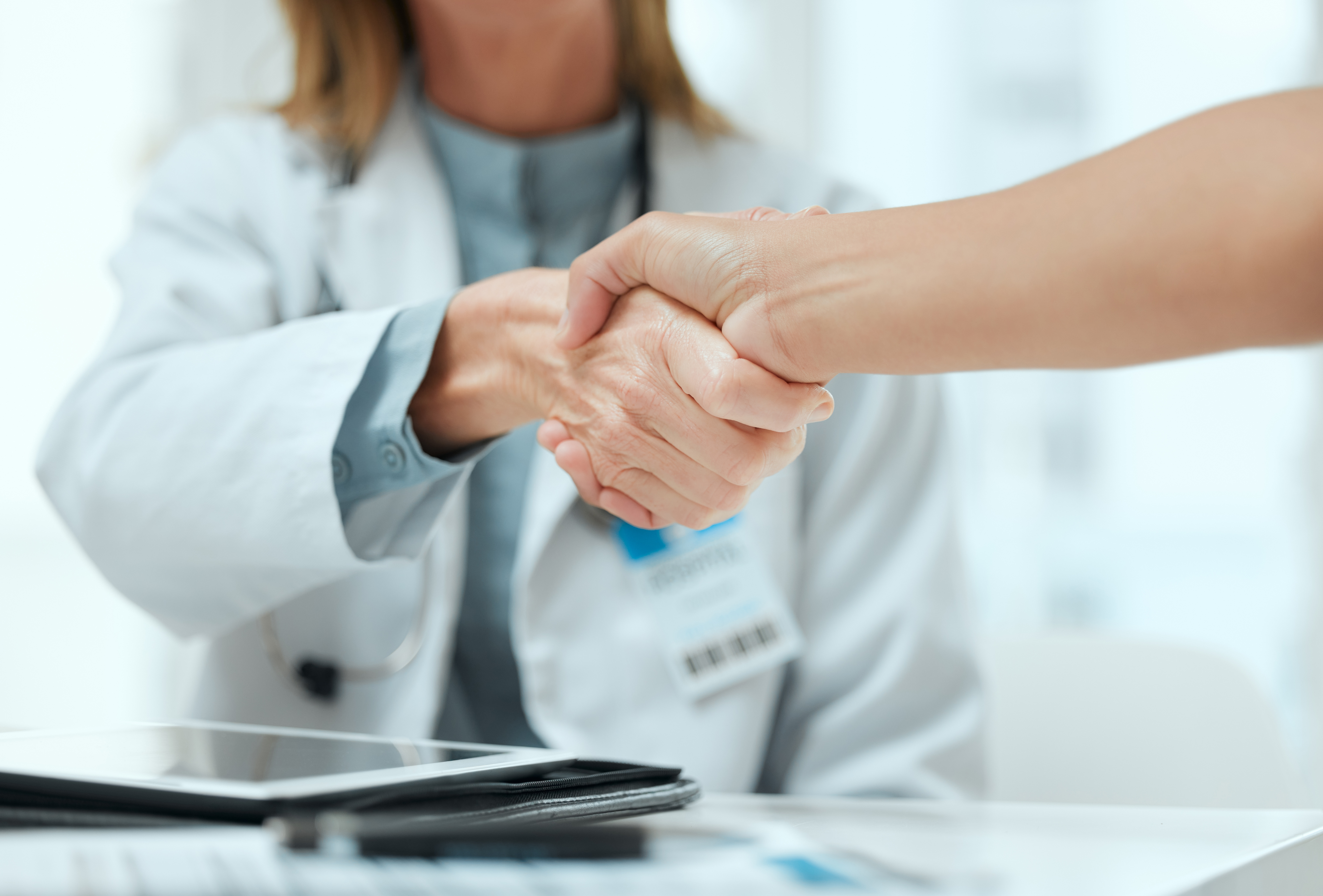 Medical check up doctor shaking hands