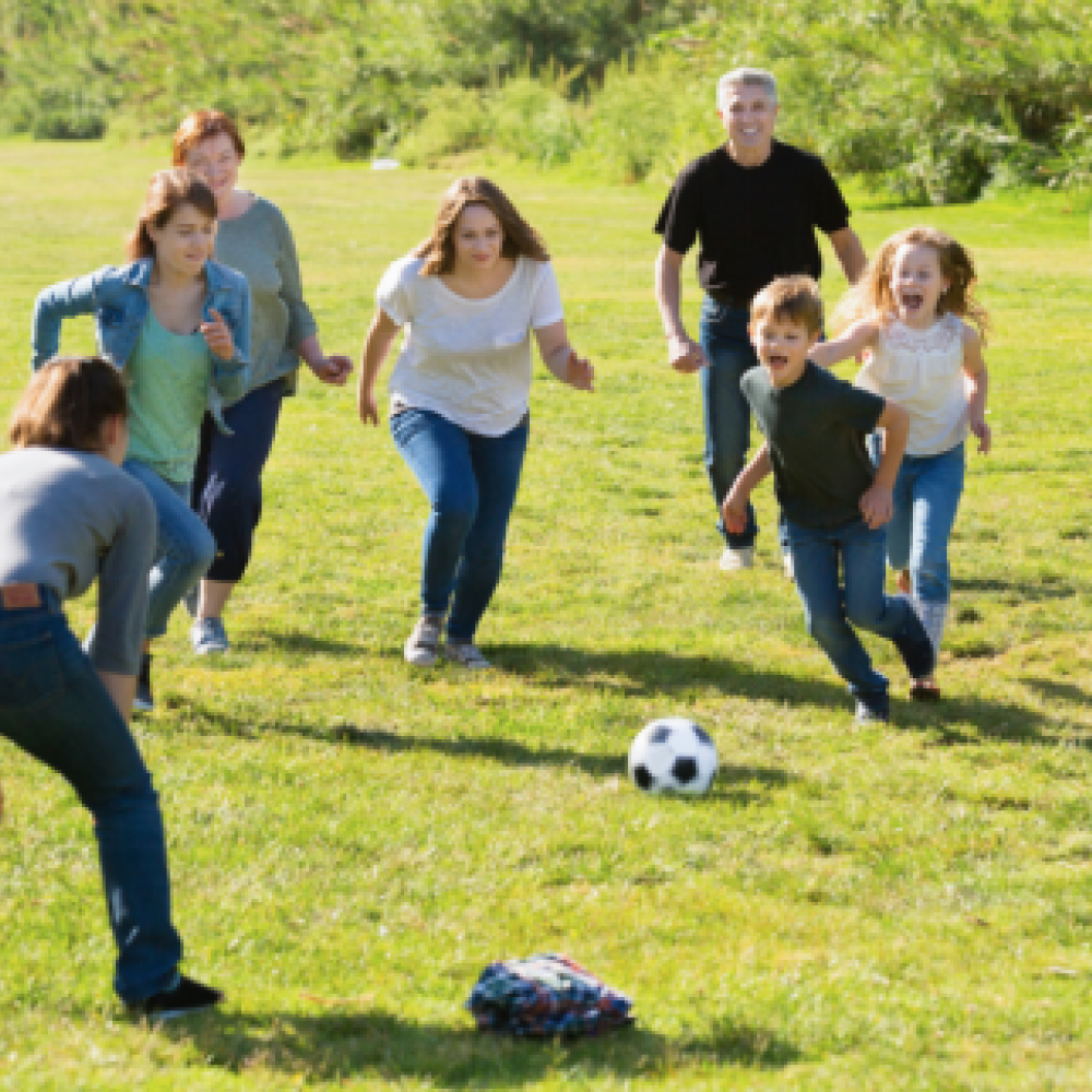 Family playing soccer